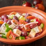 Horiatiki Greek salad with feta cheese in the bowl