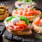 Closeup of crisp mix of bruschetta with fresh ingredients